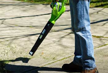 Cordless Leaf Blower Blowing Grass Off Sidewalk